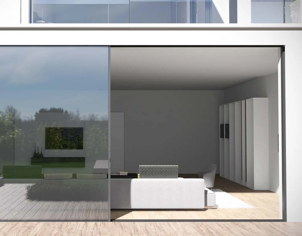 Slim aluminium sliding door opening a living room onto the garden