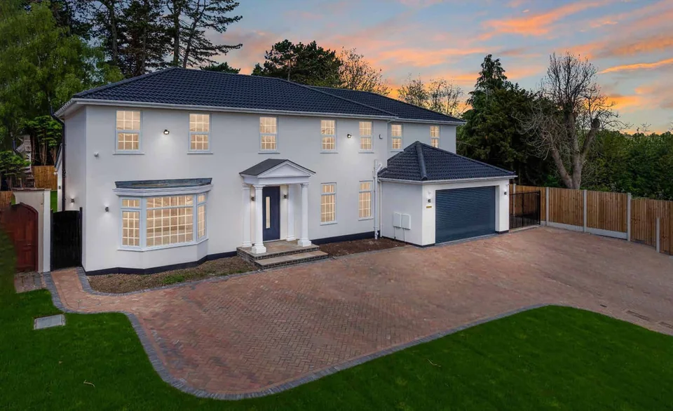 White detached home with new windows and front door – Hale Windows And Doors