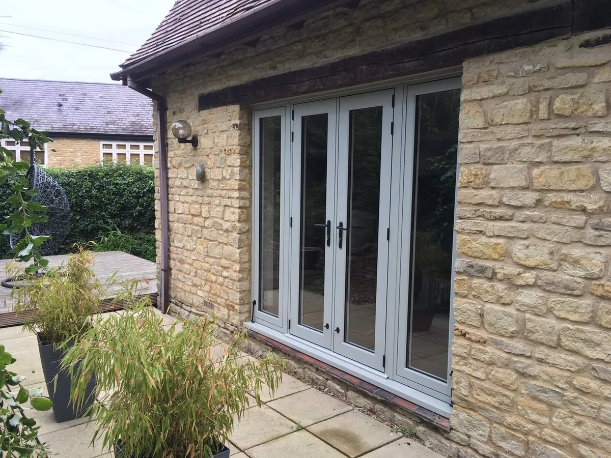 Stone property in Timperley with agate grey heritage flush French doors